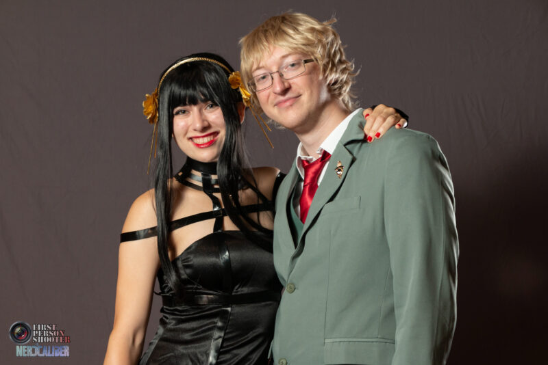 A couple cosplaying Yor Forger, left, and Loid Forger, right, from the anime series Spy x Family.