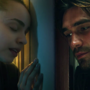 Sofia Carson and KJ Apa try to connect through a closed door during a pandemic lock down.